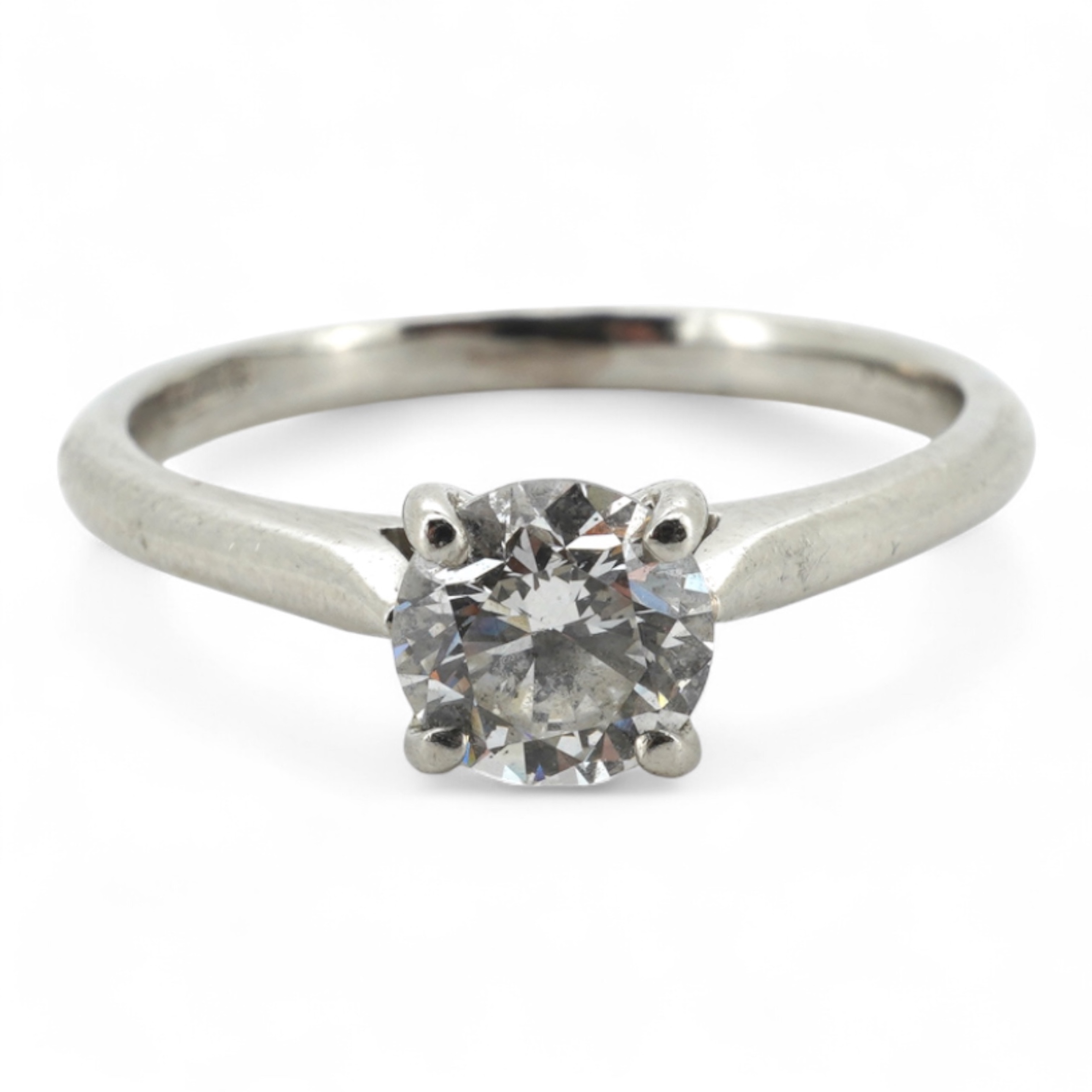 A diamond ring, claw-set with a brilliant-cut diamond weighing approximately 0.61 carats, mounted in platinum, size L, British hallmarks, gross weight approximately 3 grams